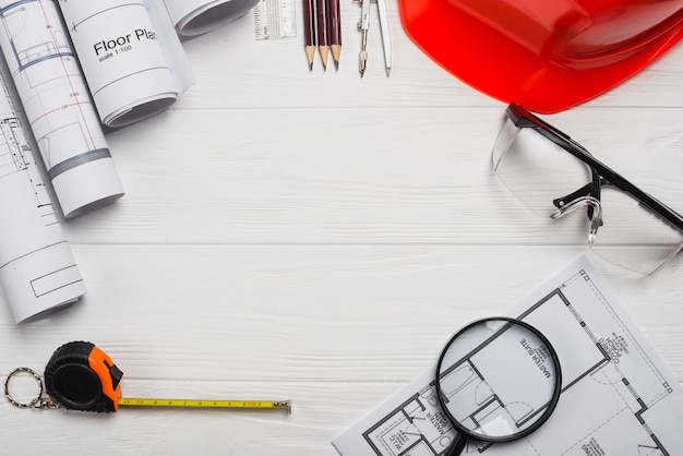 Wooden table with architect supplies