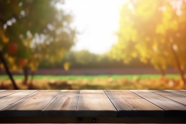 A wooden table with a blurred background of trees and the sun