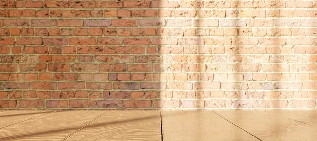 Wooden table with blurred brick wall with window illumination