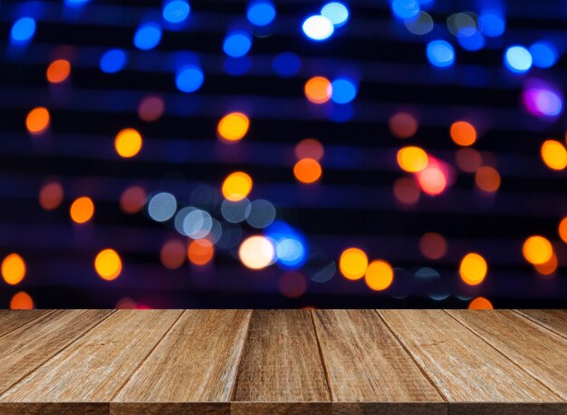 Wooden table with bokeh lights