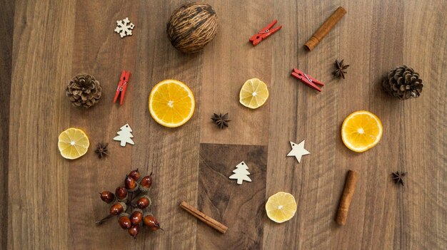 Wooden table with Christmas decorations top view