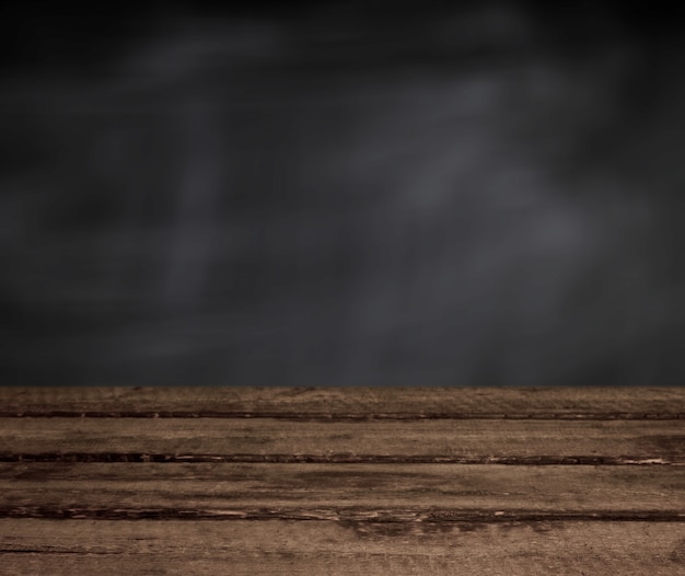 Wooden table with dark background