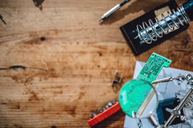 Photo of wooden table with electrical tools