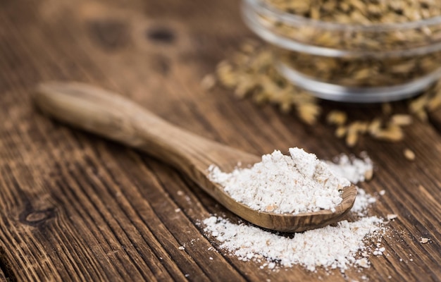 Wooden table with Oat Flour detailed closeup shot selective focus