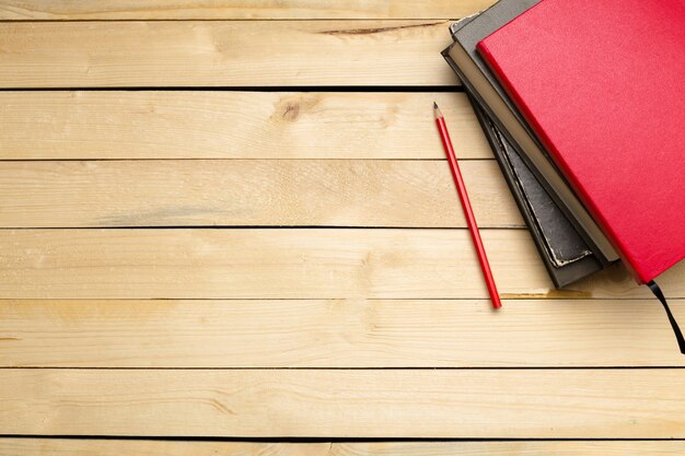 Wooden table with office supplies, top view