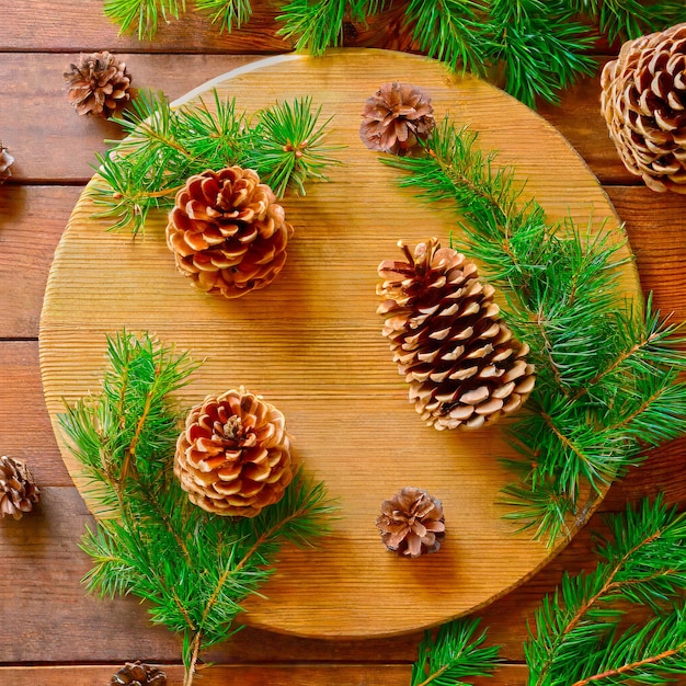 A wooden table with pine cones