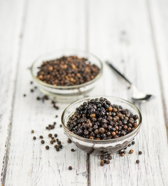 Wooden table with preserved black Peppercorns