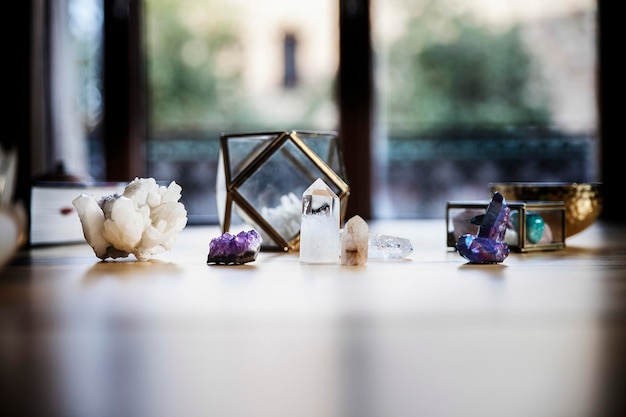 Wooden table with some crystals like quartz and amethyst