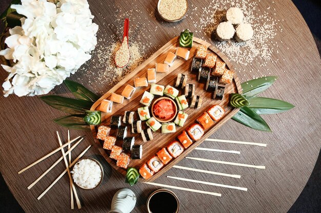 Wooden Table With Sushi and Chopsticks