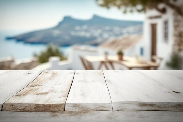 A wooden table with a view of a mountain and a house in the background.