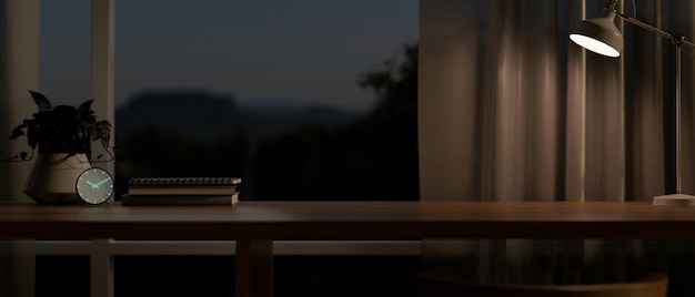 a wooden tabletop against the window in a modern dark room at night illuminated by a table lamp