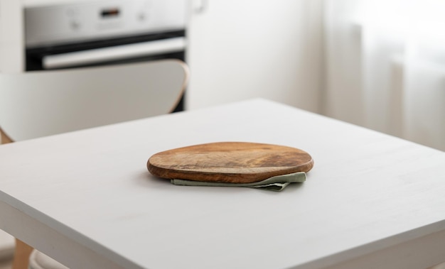 Wooden tabletop with cutting board for product montage or mockup