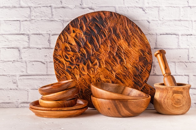 Wooden tableware on a white table