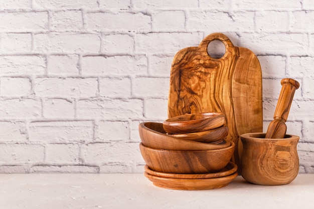 Wooden tableware on a white table