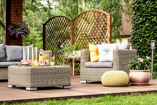 Wooden terrace with yellow pouf