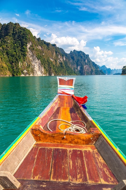 Wooden thai traditional long tail boat on Cheow Lan lake in Thailand