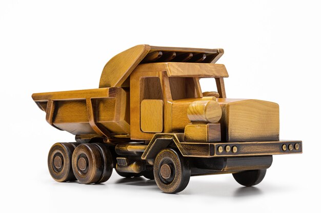 Wooden toy car on white surface