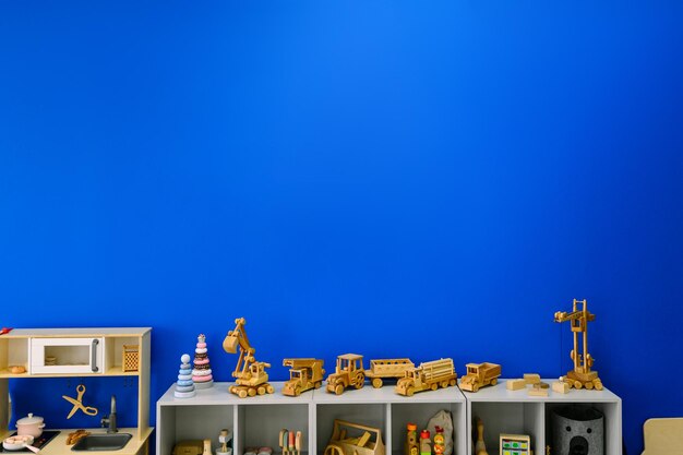 Wooden toy cars on a blue background