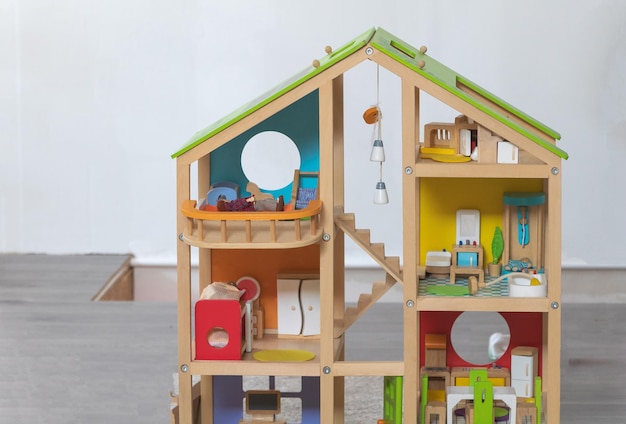 Wooden toy house in a children's playroom Toys for children