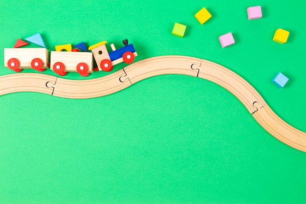 Wooden toy train with colorful blocks and wooden railway