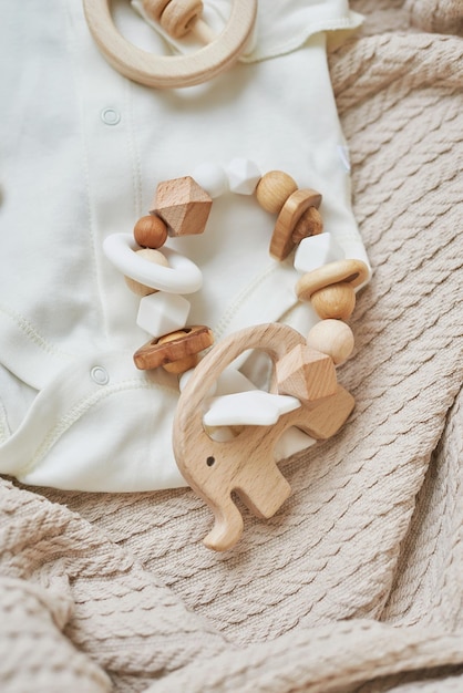 Wooden toys, rattles, teethers, nipple holder. Baby development, fine motor skills. Children and newborn products and accessories. Kids clothes. Wish list for pregnancy and baby shower.