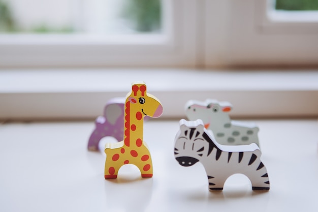 Wooden toys on the window sill