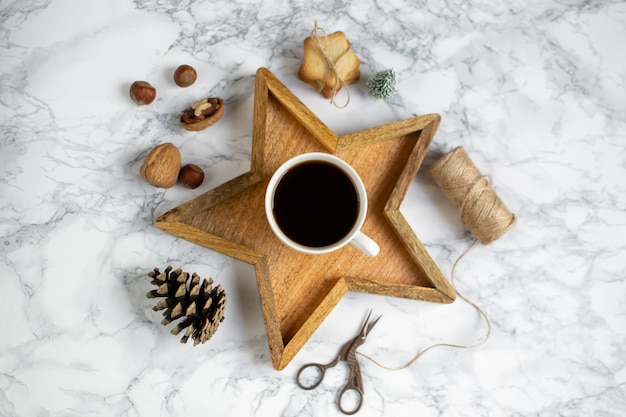 Wooden Tray Star Cup with Black Coffee Christmas Morning Gift Box Laptop New Year Concept