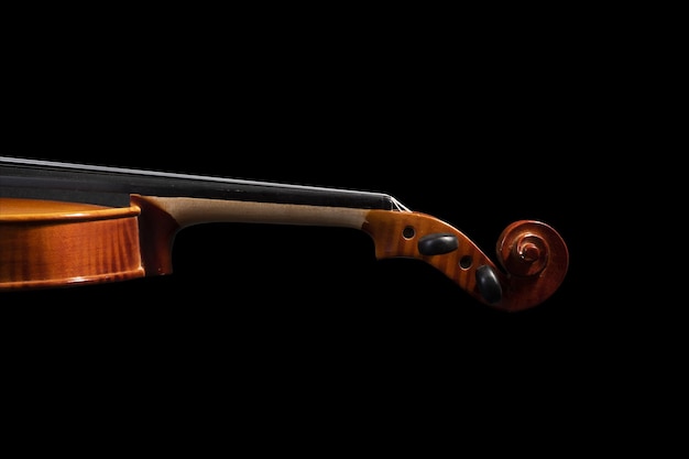 Wooden violin isolated on a black background