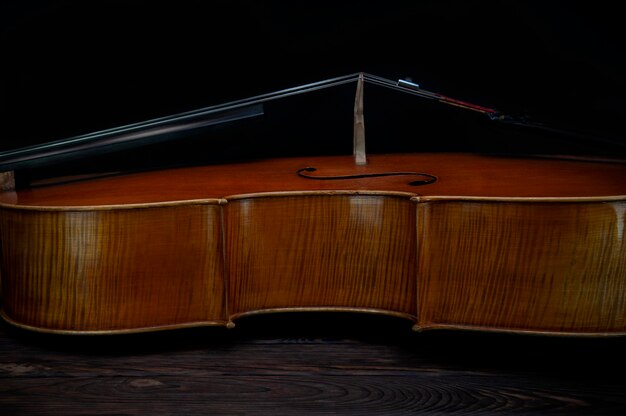 Wooden violin with strings close up