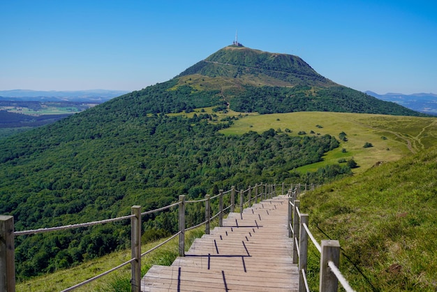 Wooden walking path to access puy de dome french chain mountains volcano