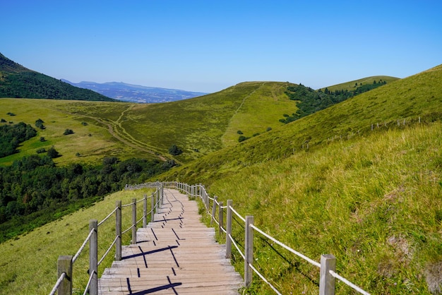 Wooden walking path in puy de dome french mountains volcano