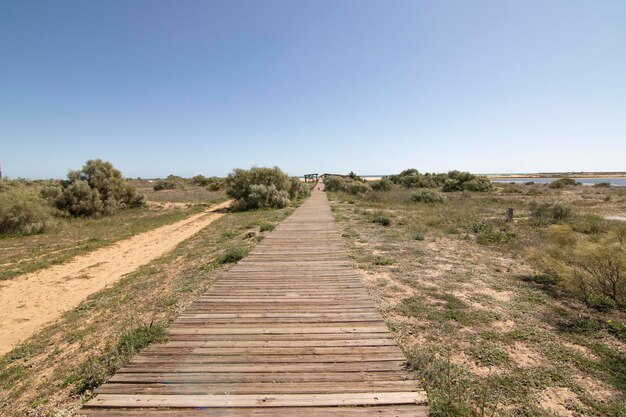 A wooden walkway on the beach of Isla Cristina Spain Widely used by vacationers on vacation