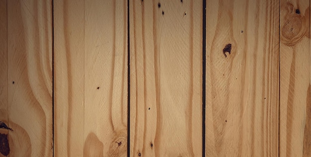 A wooden wall with a dark stain on it