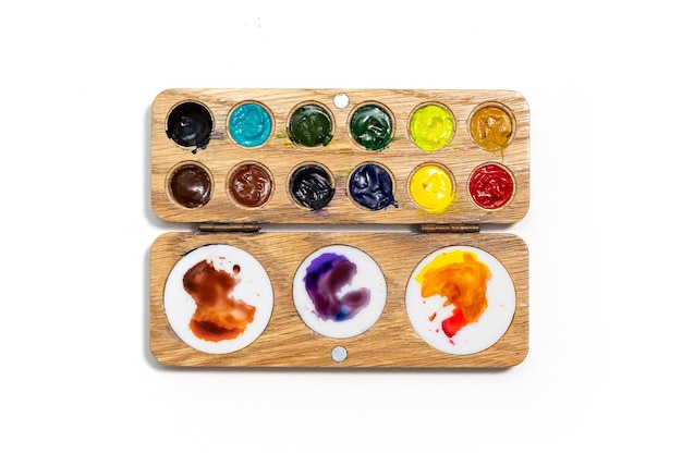 Premium Photo  Wooden watercolor palette watercolor tray with watercolor  set isolated on a white background