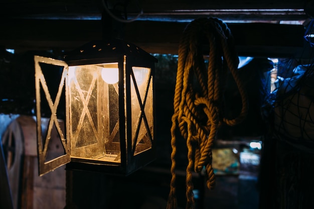 Wooden winch of a sailing ship and ropes on the deck of medieval pirate warship