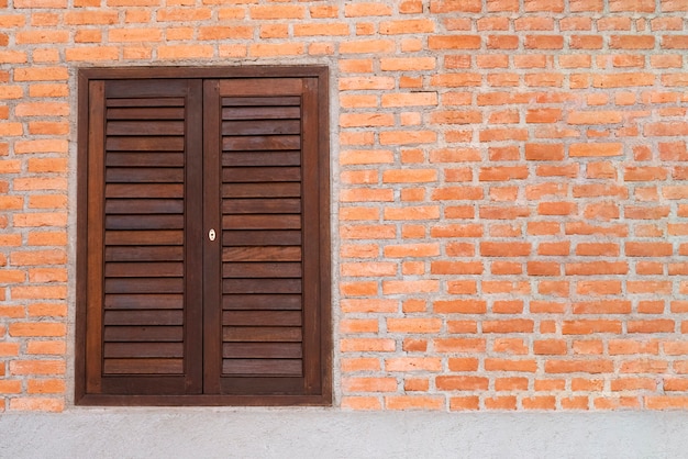 Wooden windows and red brick walls.
