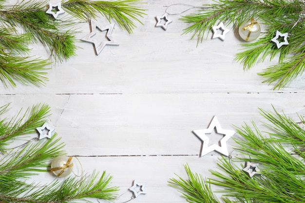 Wooden with fir branches, christmas stars and balls