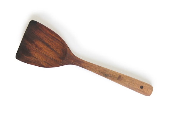 The wooden wok spatula isolated on white background.