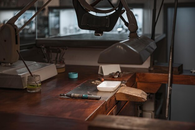 wooden work table and jeweler's tools