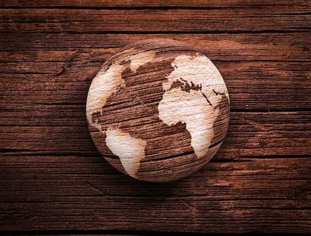 Wooden world on wooden surface