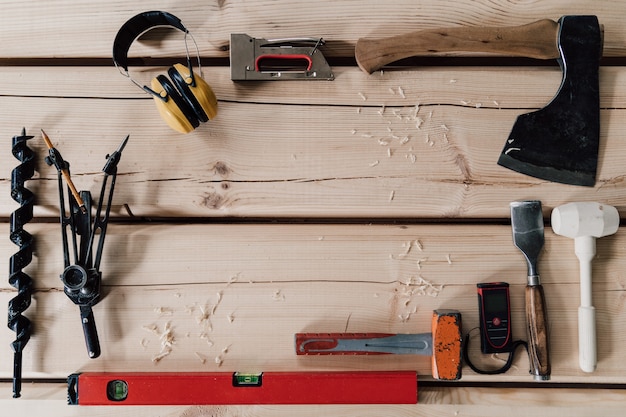 Woodwork tools on a wood background