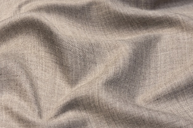 Wool fabric. Color beige. Texture, background, pattern.