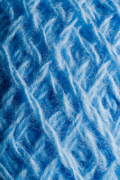 Wool yarn close-up with blue threads for needlework