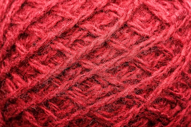 Wool yarn close-up with red threads for needlework