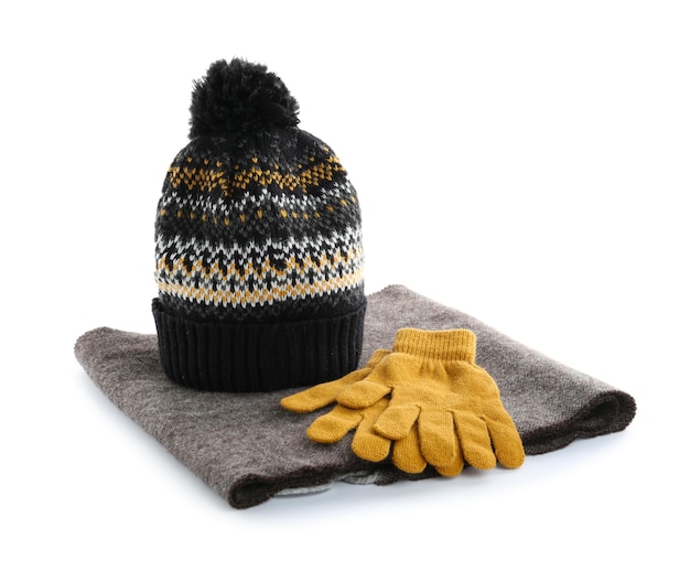 Woolen gloves scarf and hat on white background