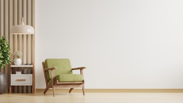 Woonkamer heeft een groene fauteuil op een lege witte muurachtergrond