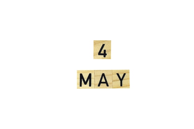 The word 4 may in wooden letters on a white background text congratulation spring holiday