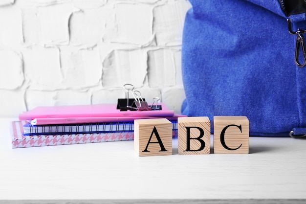 Photo word abc with stationery set on light surface