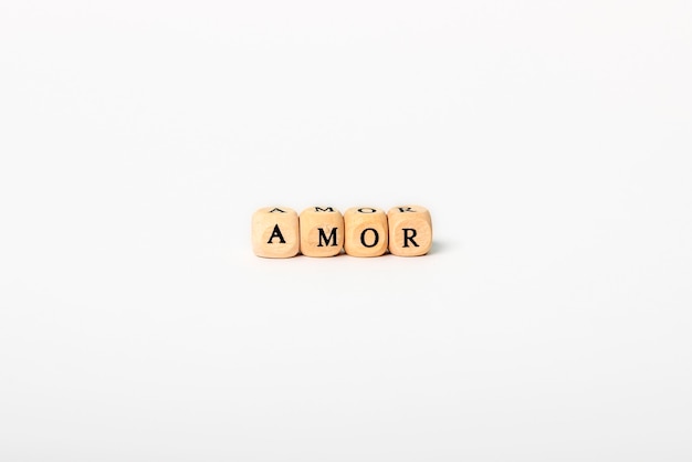 Word amor in wooden letters isolated on white