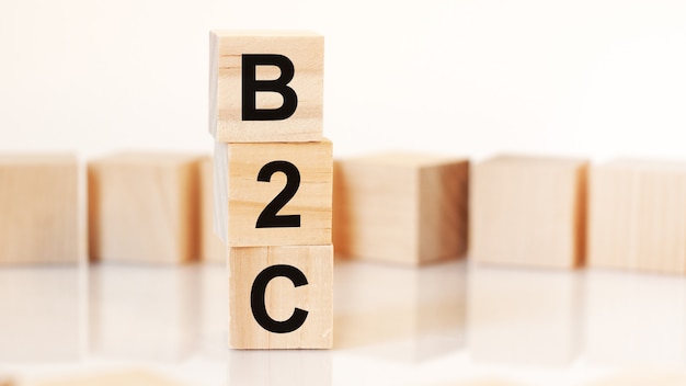 Word B2C from wooden blocks with letters, concept.